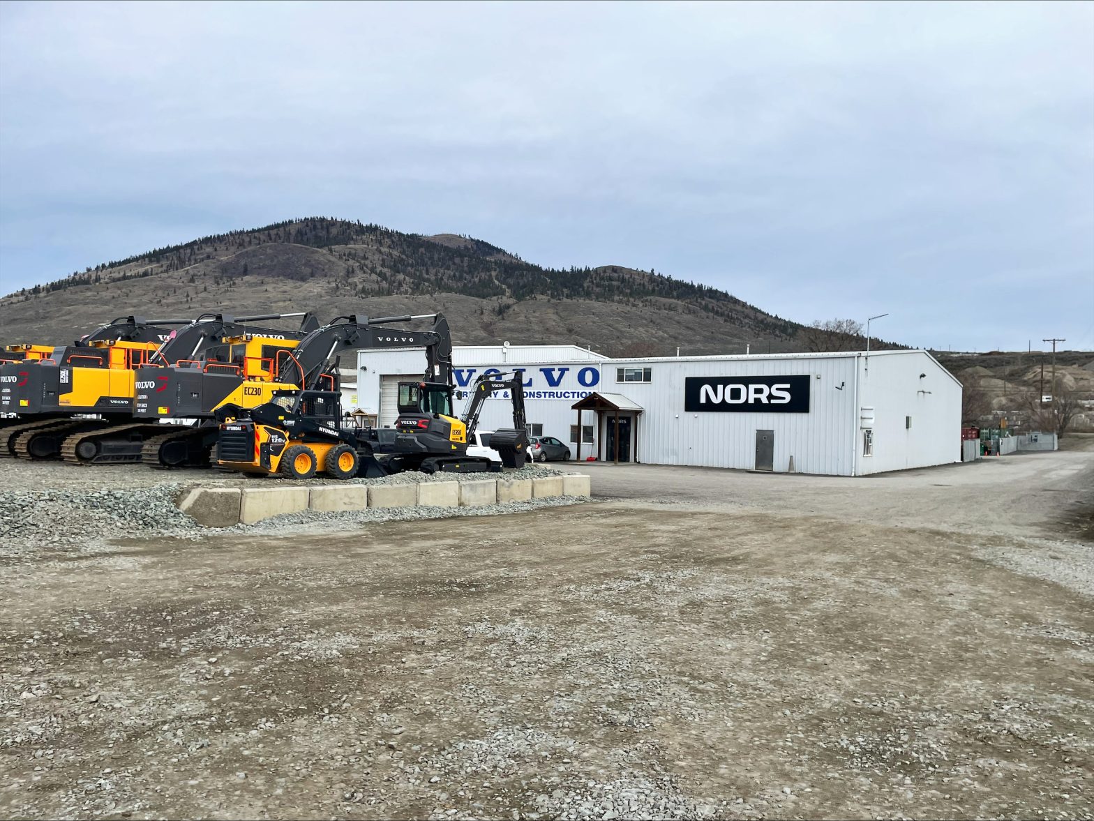 Picture of Kamloops location for heavy equipment dealership: Nors. Shows Volvo excavators.
